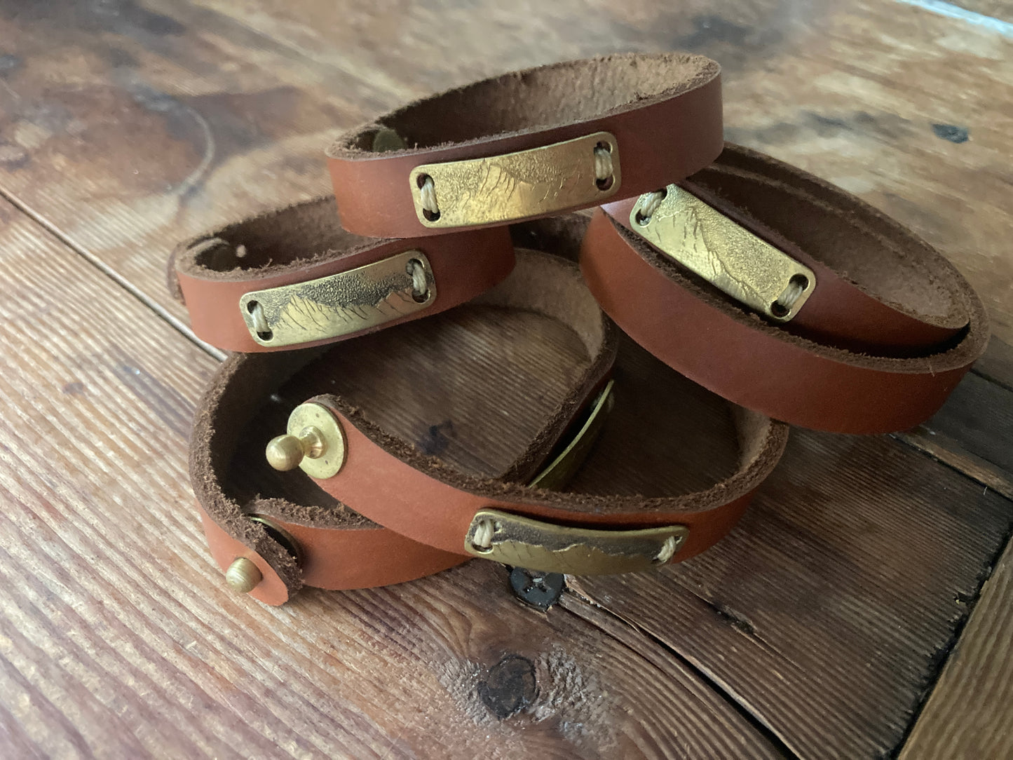 Leather cuff with engraved landscape