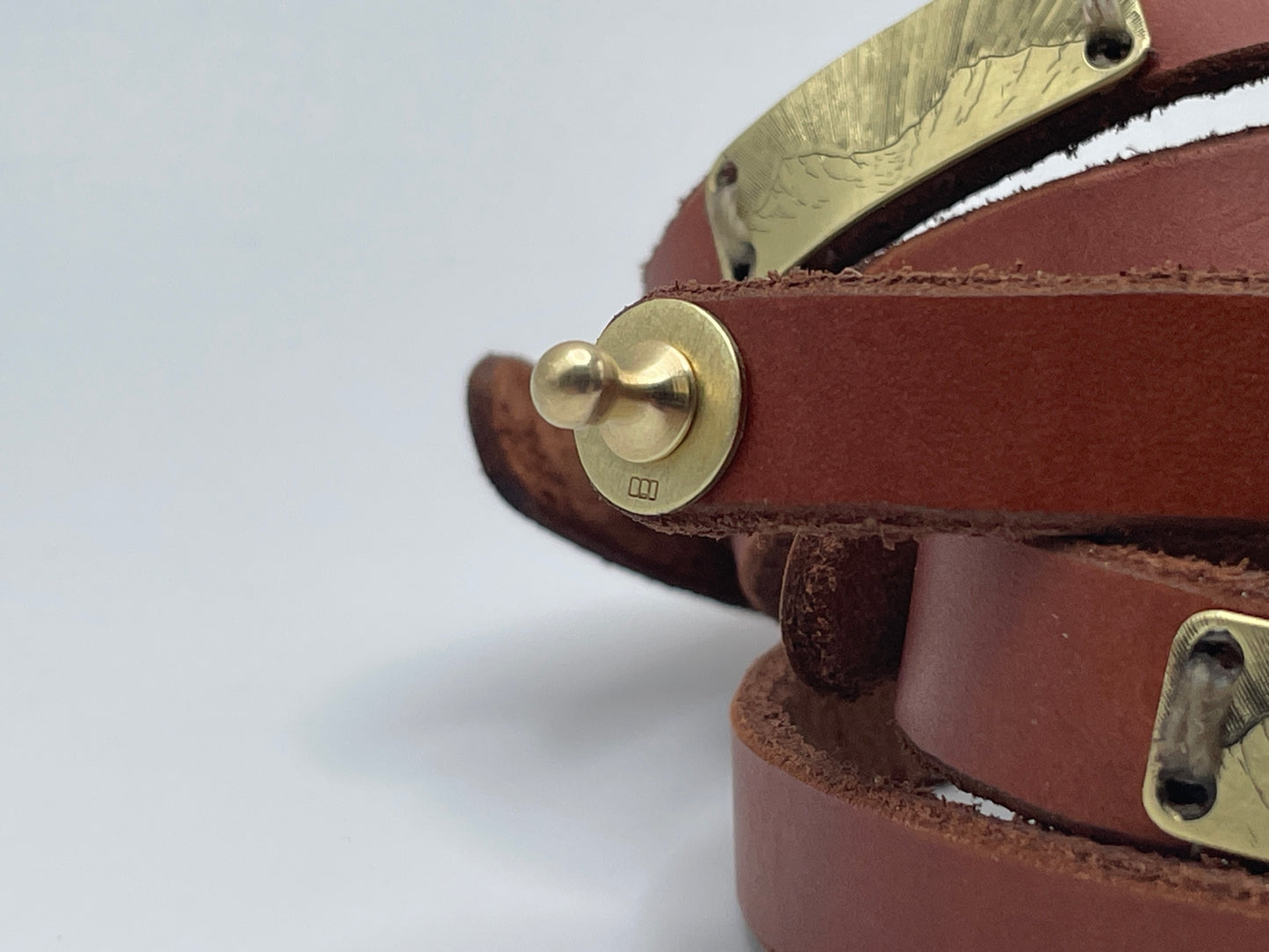 Leather cuff with engraved landscape